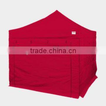 Customized pop up tent for events with red wall