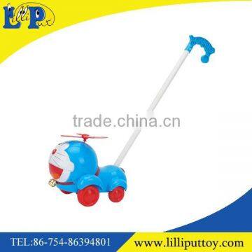 Children hand pushing cartoon car toy