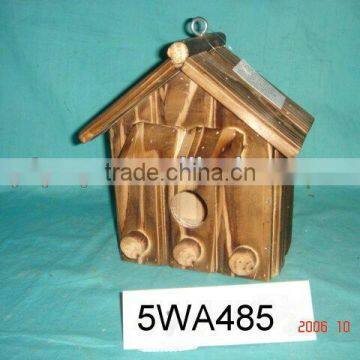 burned wooden bird house