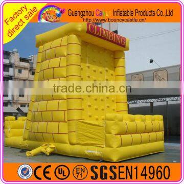 Yellow castle inflatable rock climbing wall, challenge sport game for kids