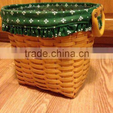 Woven wood chip oval waster basket with liner protector