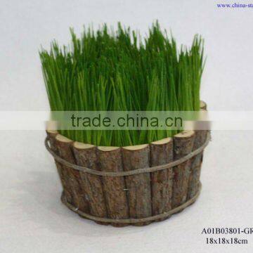 artificial grass in round wooden planters