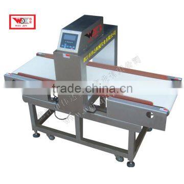 Automatic metal detector for smoked sheet