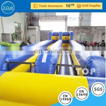 Guangzhou supplier gladiator game inflatable interactive bungee run bouncy castles for sale with EN14960