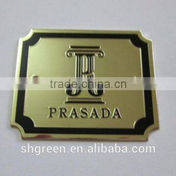 Shiny surface bronze color metal plate with engraved logo