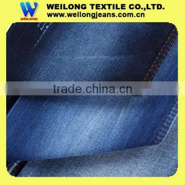 M0067-B 62/63" 9.4oz indigo blue slub stretch denim fabric for female pants