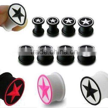 Pink five star and black slicone ear tunnels ,