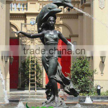 Bronze girl with dolphin spraying water sculpture