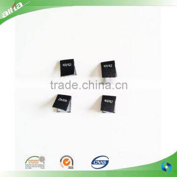 Allta Group manufactures woven main labels for clothing, fold over size label tags