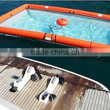 inflatable swimming pool floating on water deployed