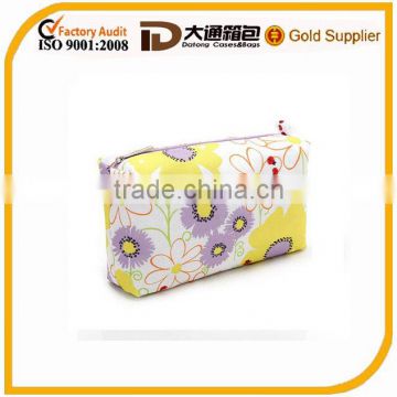 colorful beautiful cosmetic cases with sunflower pattern used for toiletry