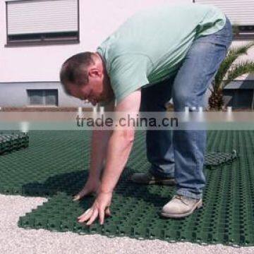 Laying Plastic Pavers for Green Grass Driveway photo-4
