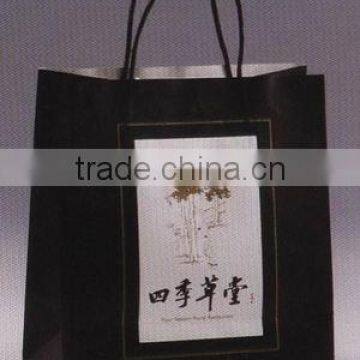 Leisure wear machine made paper bags with handle for clothes