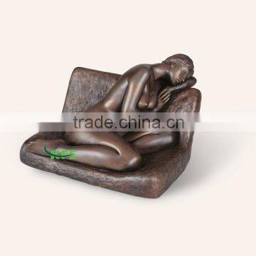 Bronze naked lady on sofa sculpture