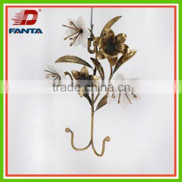 Decorative metal hook with porcelain flower