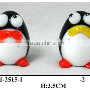 small glass penguin with big eyes and belly