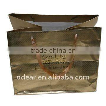 golden shopping bag with embossed logo