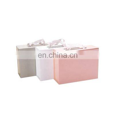 Custom Gift Packaging Foldable Magnetic Paper Box With handle Gift Favors Custom Clothing Packaging Box With Ribbon