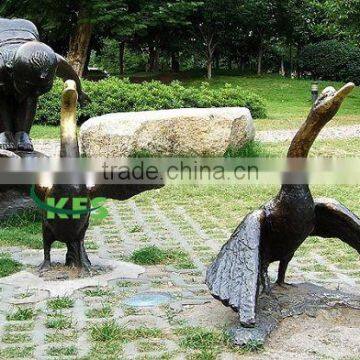 Bronze children and geese outdoor statue