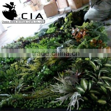 Movable artificial living wall with leaves , grass