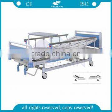 Hot sale CE AG-BYS115 over bed table integrated 2 carnks manual hospital bed