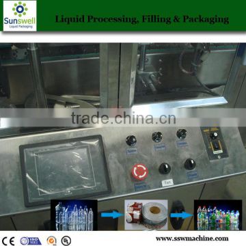 Label applicator machine of PET juice bottle