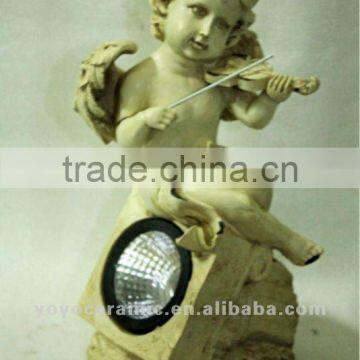 cherub playing violin figurine with lamp