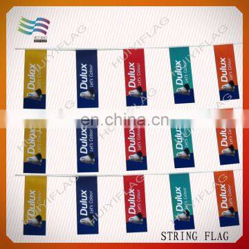 decorative hanging flags and banners on string