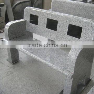 European style stone bench in cemetery