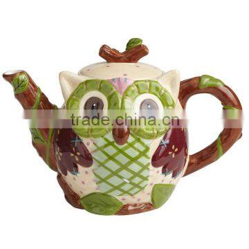 Hand-painted ceramic teapot with colorful owl design