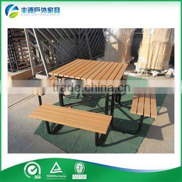 Outdoor picnic table setting, public seating, Plastic wood dining set