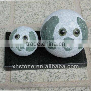 Green round dog stone statue