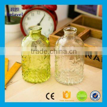 Manufacture cheap embossed clear glass vase colorful glass flower vase