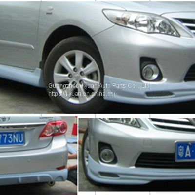 The Toyota Corolla car is surrounded by a 11-13 Carora front and rear spoiler skirt