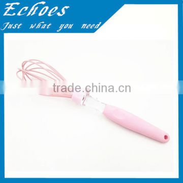 Pink silicone whisk