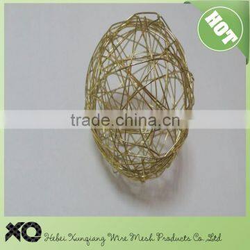 gold colored aluminium wire ball