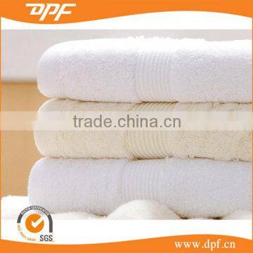 100% cotton beige color with satin border bath towel