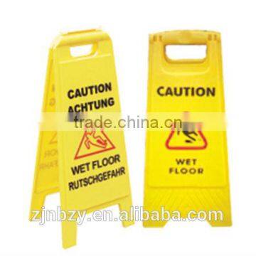 yellow plastic caution standing board