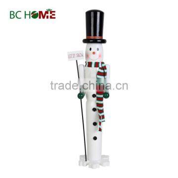 exquisitely crafted snow man wooden Nutcracker with placard