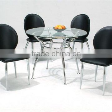 Round dining table and black dining chairs