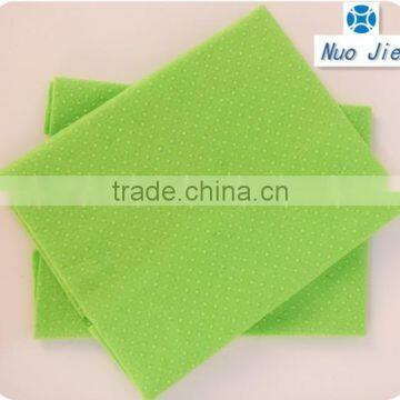 green needle punch cloth with white dot