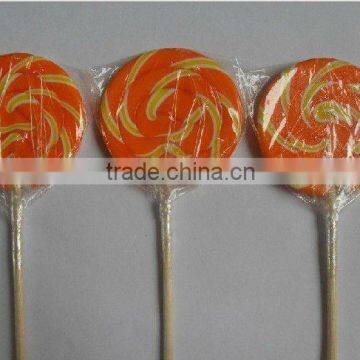 orange round flat lollipop