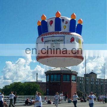 Large inflatable helium birthday cake balloon for advertisment