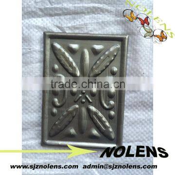 wrought iron leaf stamped design on gate