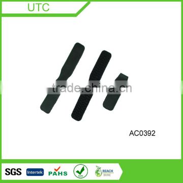 PVC injection on adhesive hook and loop for zipper puller