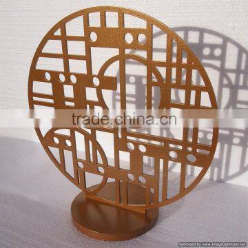 golden metal round sculpture