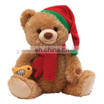 Christmas teddy bear with a bird