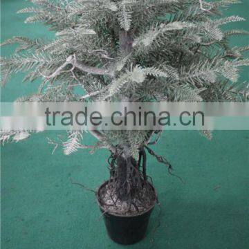 Holy and pure artificial Christmas tree in pot