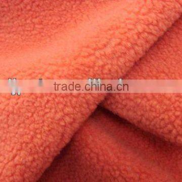 Solid orange anti-pilling polar fleece fabric