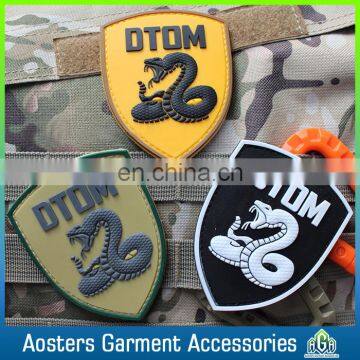 customized own brand pvc patches snake logo rubber clothing patches